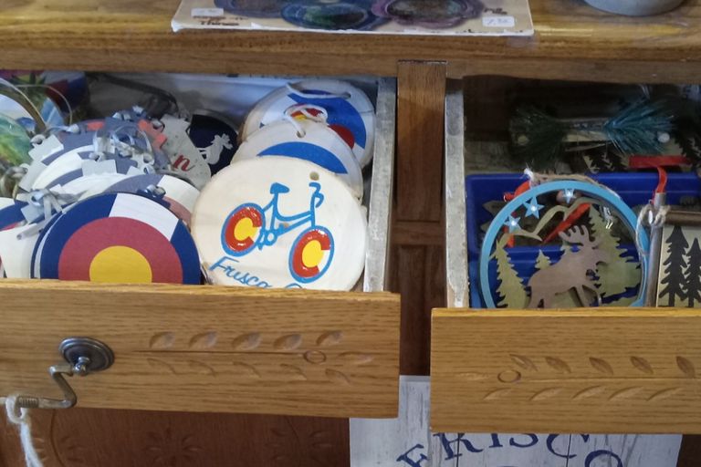 The handcrafted ornaments from Round The Mountain Gift Shop