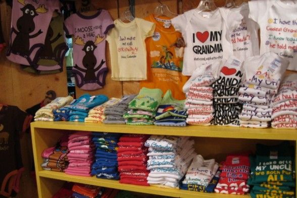 A sample of baby clothes found at Round The Mountain Gift Shop